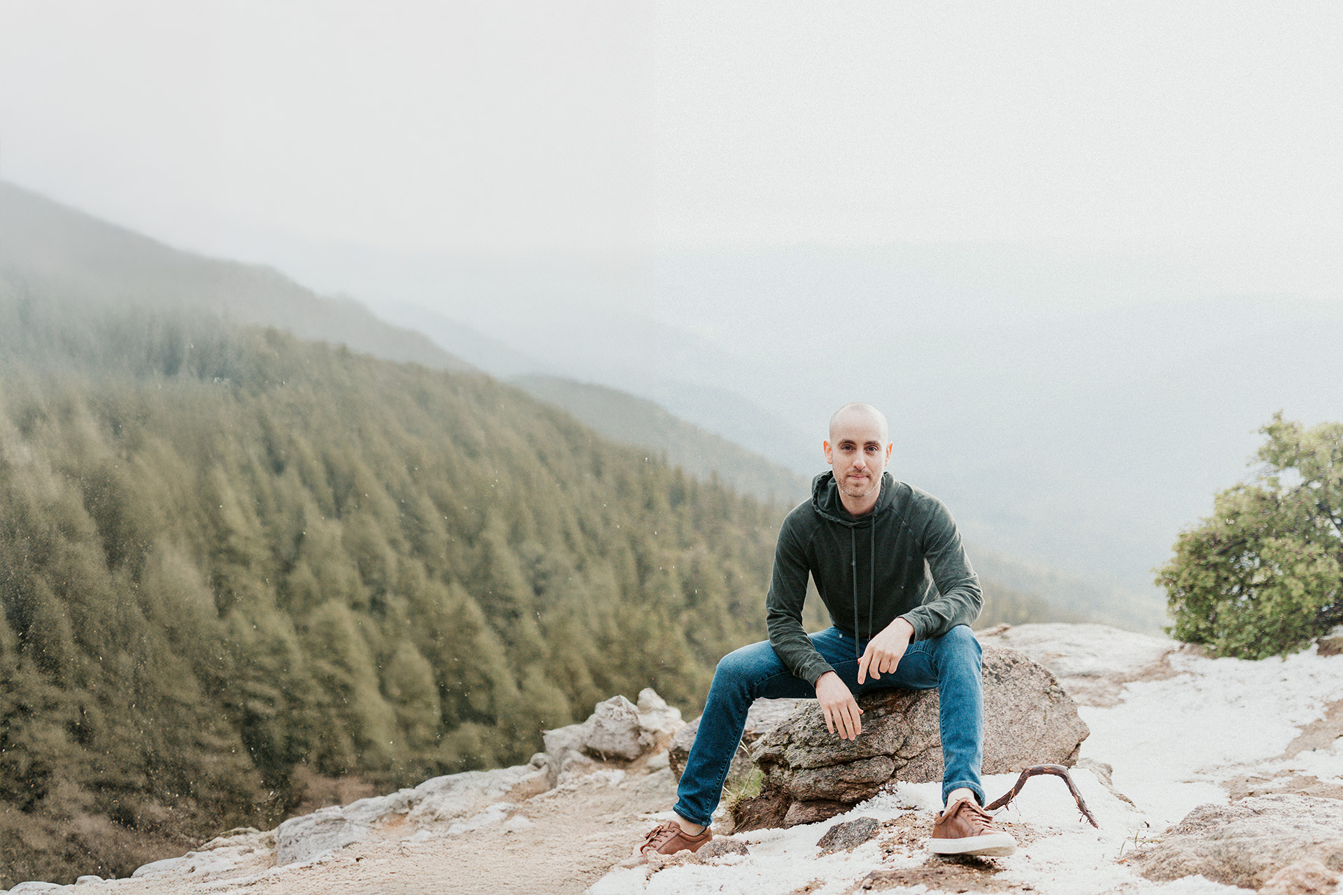 Jason Moss standing in mountain landscape at golden hour