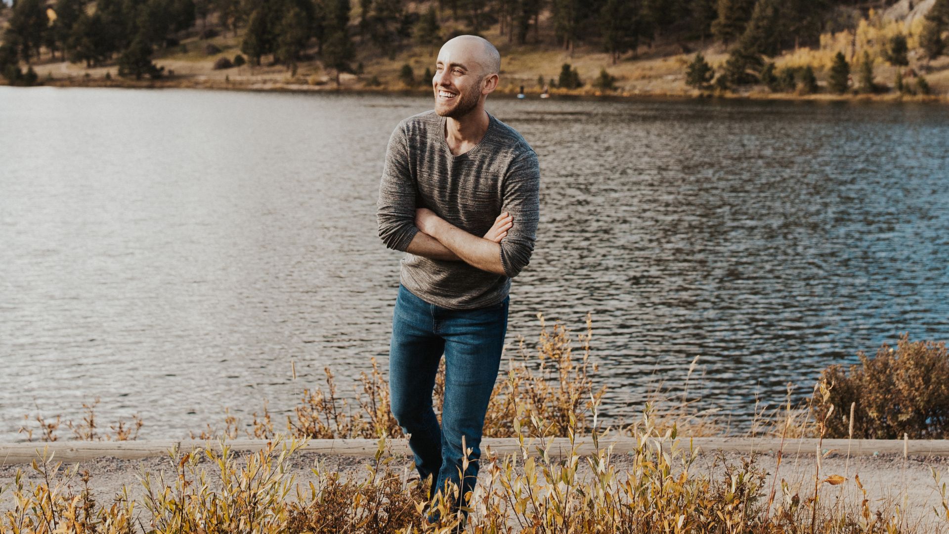Jason standing by a serene lake